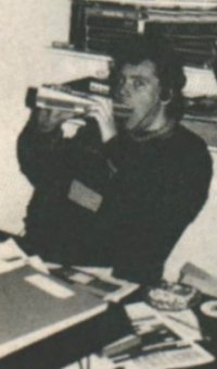 Gary Penn showing how to go to work on an NEC portable computer - he's putting on weight from eating so many of them.